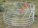 Circular feeder with diagonal rails for 15 animals